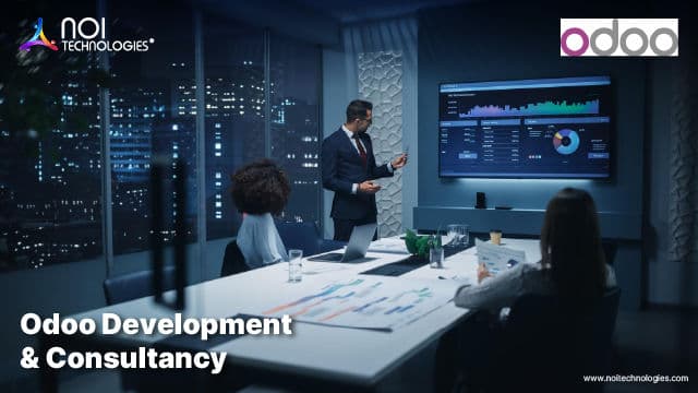 NOI Technologies consultants presenting an Odoo business dashboard during a client implementation meeting